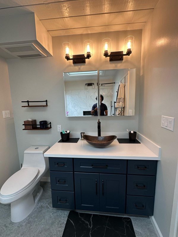Luxury bathroom remodel — frameless glass shower and custom tilework by our bathroom remodeling company