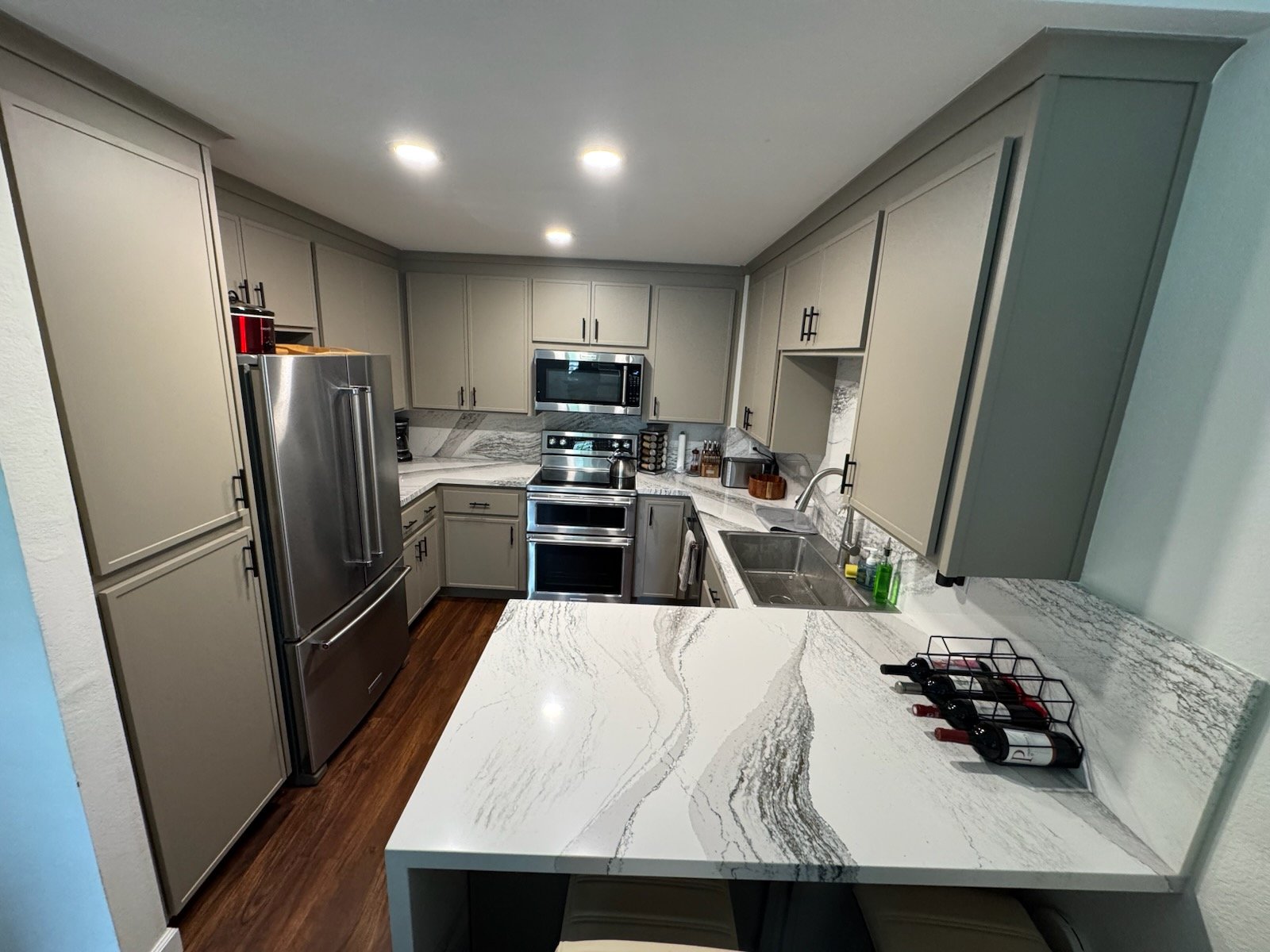 Custom kitchen remodel — modern cabinets, quartz countertops, and open layout by our kitchen remodeling contractors